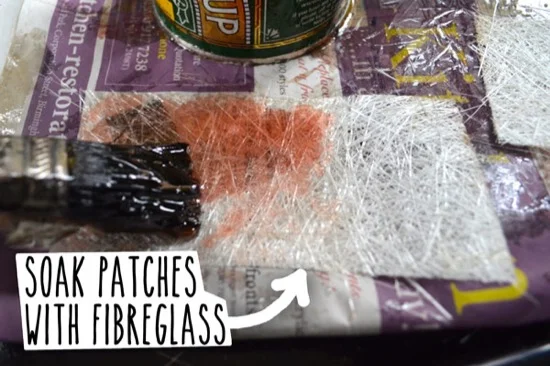 Soaking patches with fibreglass