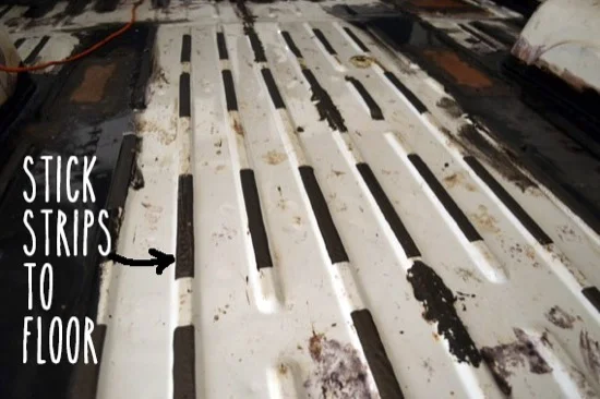 Sticking bitumen strips to floor of van