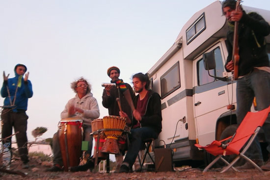 Morocco-by-campervan-sidi-kaouki-beach-van-band-playing-music